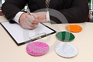 Businessman in the office signs a contract for the supply of pla