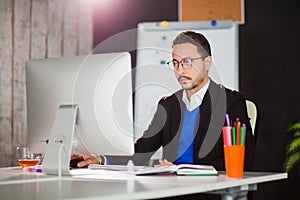 Businessman at office work with computer monitor.