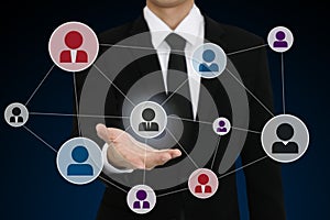 businessman with open hand presenting social network icon