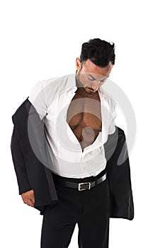 Businessman opening his shirt revealing muscular torso