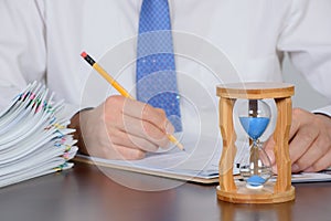 A businessman organizing a large number of documents