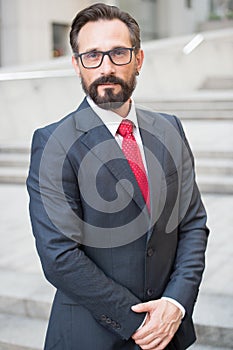 Businessman outdoor on office center background. Successful business person portrait. Professional people