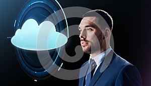 Businessman over black with cloud projection