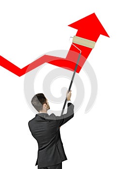 Businessman painting arrow