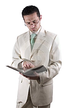 Businessman with a pair of glassed reading a book photo