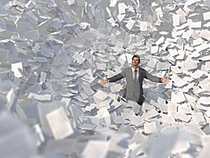 Businessman in a paper avalanche