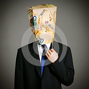 Businessman with a paper bag on the head.