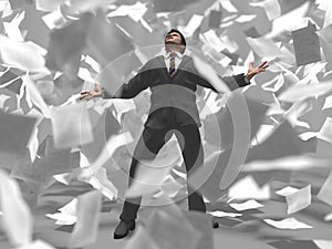 Businessman in a paper storm