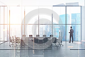 Businessman with papers in office meeting room