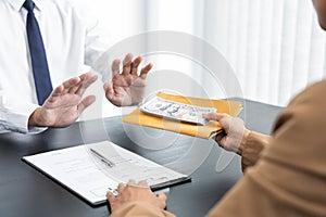 Businessman partner hand gesture rejecting refusing money, anticorruption concept photo