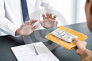 Businessman partner hand gesture rejecting refusing money, anticorruption concept photo