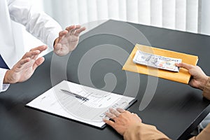 Businessman partner hand gesture rejecting refusing money, anticorruption concept photo