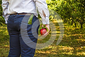 Businessman with peach in his hand