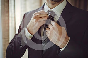 Businessman Perfecting His Tie. Generative ai photo