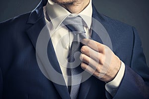 Businessman Perfecting His Tie. Generative ai photo