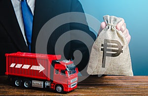 Businessman with philippine peso money bag and truck. Good salaries for drivers. Rising prices, global containers shortage crisis
