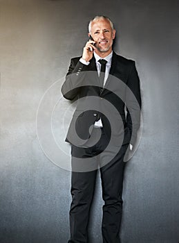 Businessman, phone call and happy for communication, contact and network in studio. A senior entrepreneur person on a