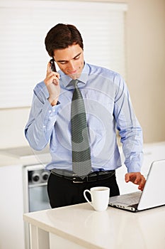 Businessman, phone call and laptop with coffee for discussion or communication in kitchen at home. Man or employee