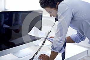 Businessman, phone call and paperwork at computer for conversation with client for financial advice, loan or investment