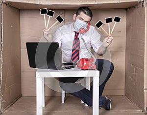 Businessman is on a phone call, protective mask on his face and placard with copy space in hand