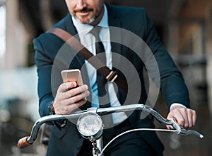 Businessman, phone in hands and bicycle outdoor for communication, travel and transportation. Entrepreneur person with a