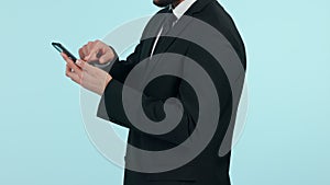 Businessman, phone and hands typing in social media, communication or networking against a studio background. Closeup of