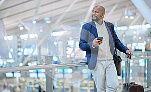 Businessman, phone and luggage at airport for travel, journey or checking flight times or destinations. Happy black man