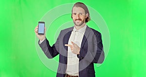 Businessman, phone and mockup on green screen with tracking markers against studio background. Portrait of man pointing