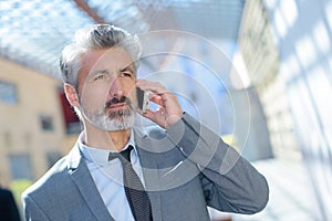 Businessman with phone in office