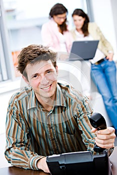 Businessman with phone at office