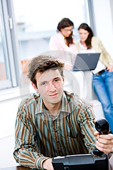 Businessman with phone at office