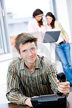 Businessman with phone at office