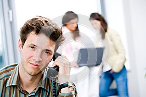 Businessman with phone at office