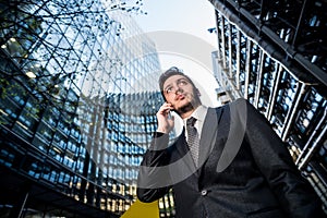 Businessman on phone office building