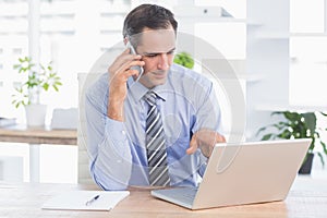 businessman phoning at his desk