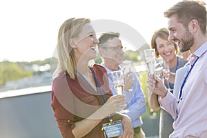 Businessman photographing colleagues during success party on rooftop