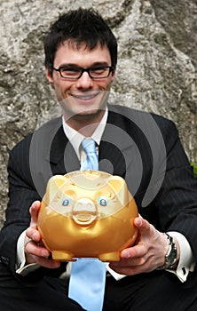 Businessman and piggy bank.