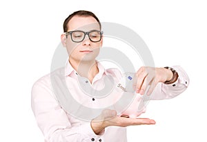 Businessman with piggy bank and money