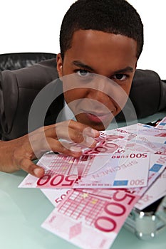 Businessman with a pile of cash