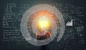 Businessman plan with a light bulb