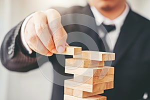 Businessman plan and strategy in business Domino Effect Problem