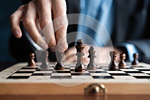 Businessman play with chess game. concept of business strategy and tactic.