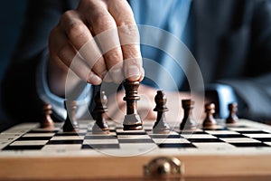 Businessman play with chess game. concept of business strategy and tactic.