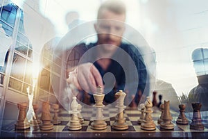 Businessman play with chess game. concept of business strategy and tactic. Double exposure