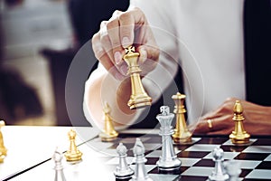 Businessman play with chess game. success management concept of business strategy and tactic challenge