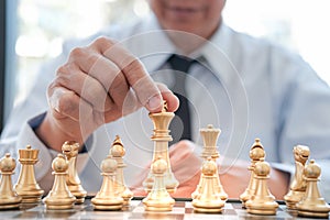 Businessman play with chess game. success management concept of business strategy and tactic challenge