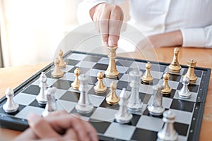 Businessman play with chess game. success management concept of business strategy and tactic challenge