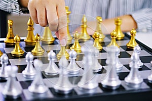 Businessman play with chess game. success management concept of business strategy and tactic challenge