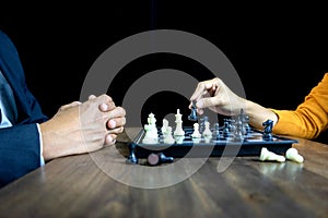 Businessman play chess how to crash overthrow the competitor