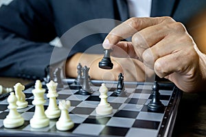 Businessman play chess how to crash overthrow the competitor